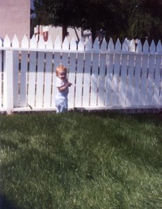 When we moved to Pasadena, James and David built a white picket fence and James and Carlton planted a bluegrass lawn for the children to play on. Here's Taylor. 