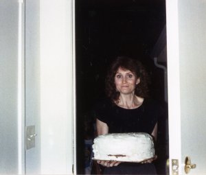 Jennifer bringing the lovely wedding cake.